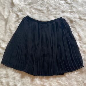 Black pleated miniskirt